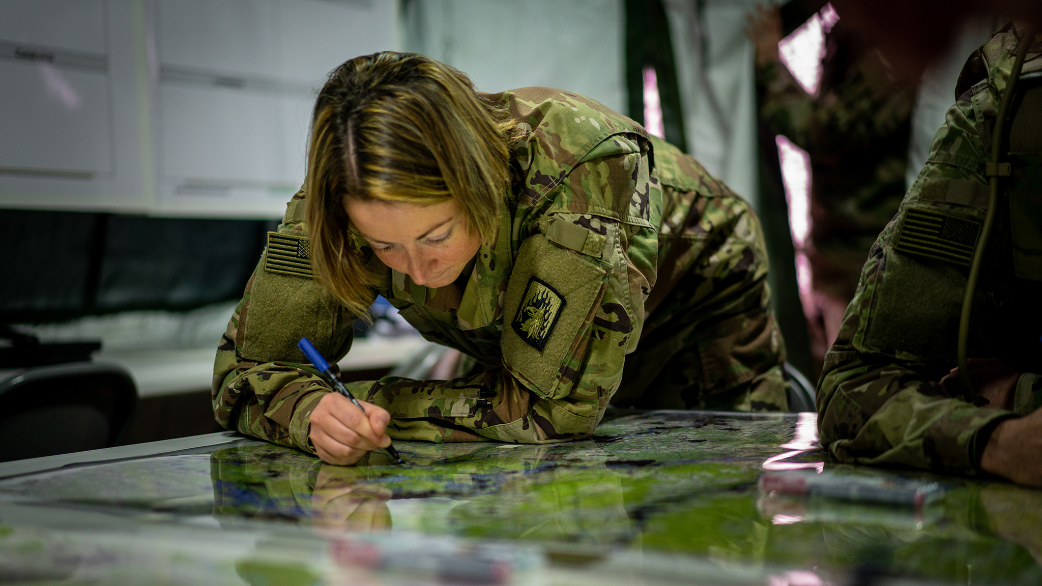 First Lieutenant Alesandra Lipari, assigned as fire support officer for 12th Combat Aviation Brigade, conducts initial planning for Dragoon Ready20 at Hohenfels Training Area, Germany, October 23, 2019 (U.S. Army/Robert Fellingham